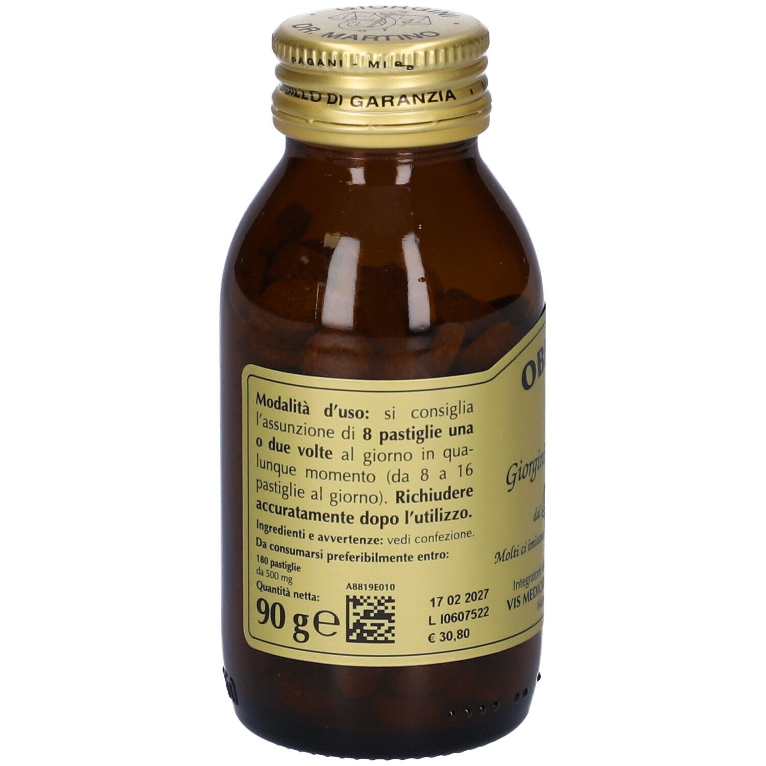 Flacone in vetro marrone con tappo dorato. Obevis-T, Giorgini Dr. Martino. Compresse visibili. Etichetta con informazioni.