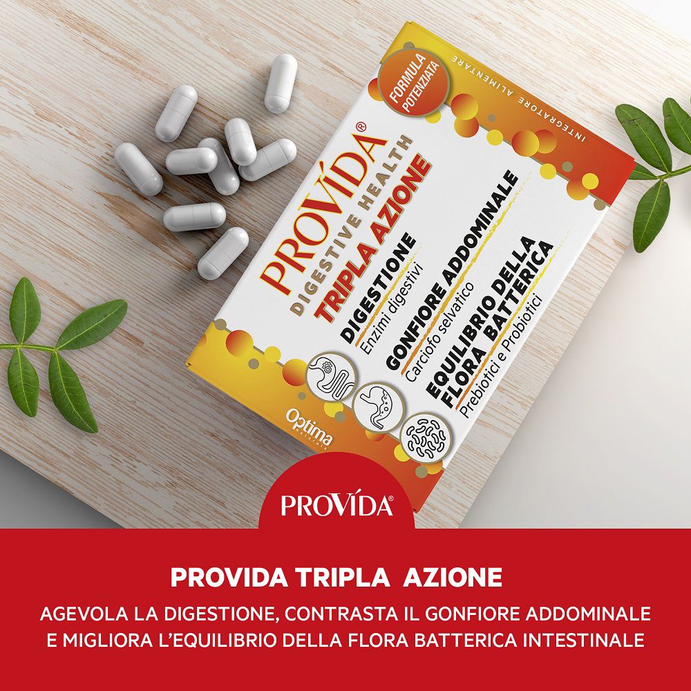 Confezione Provida Tripla Azione con capsule su tagliere in legno. Mostra digestione, gonfiore e equilibrio flora batterica.
