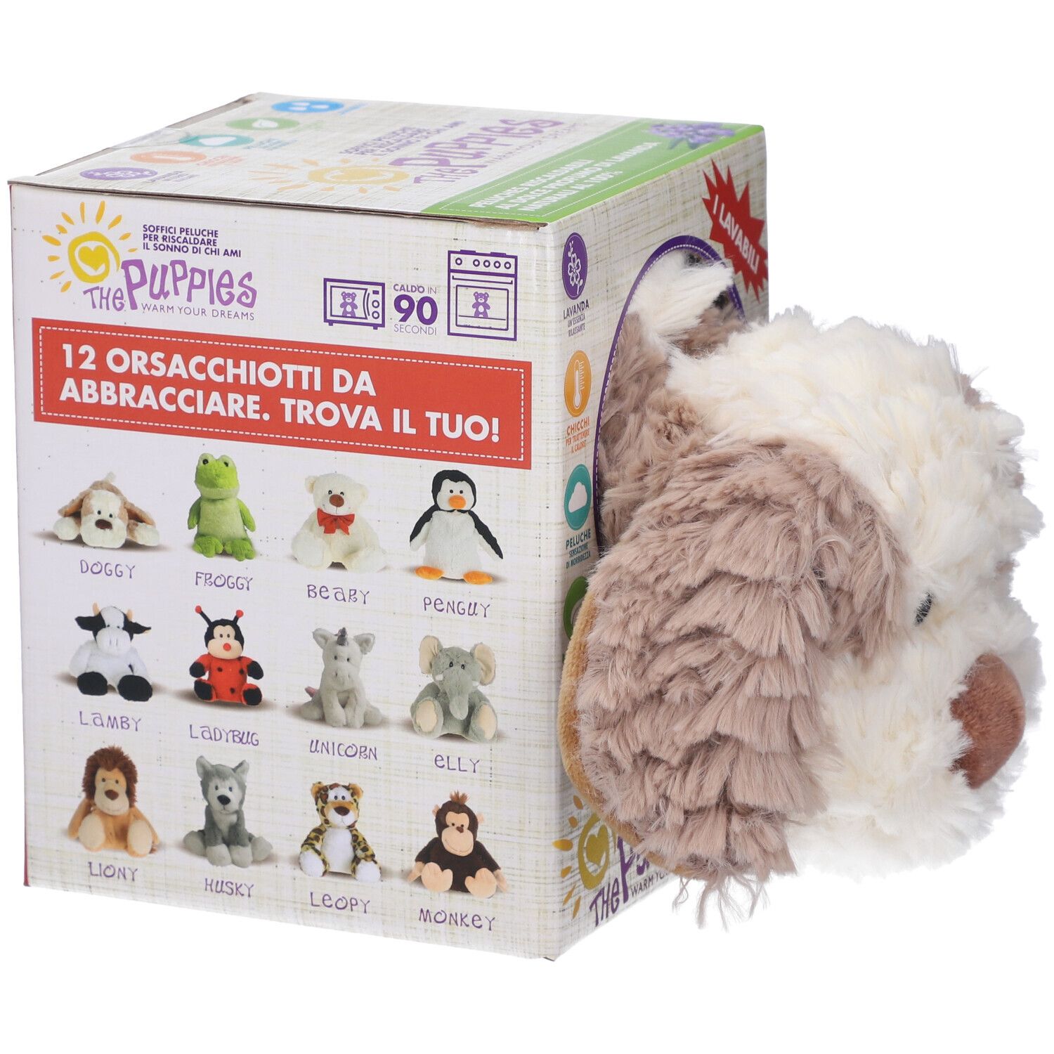 Cagnolino di peluche accanto a una scatola di cartone con immagini di 12 diversi peluche. Sulla scatola c'è scritto "The Puppies".