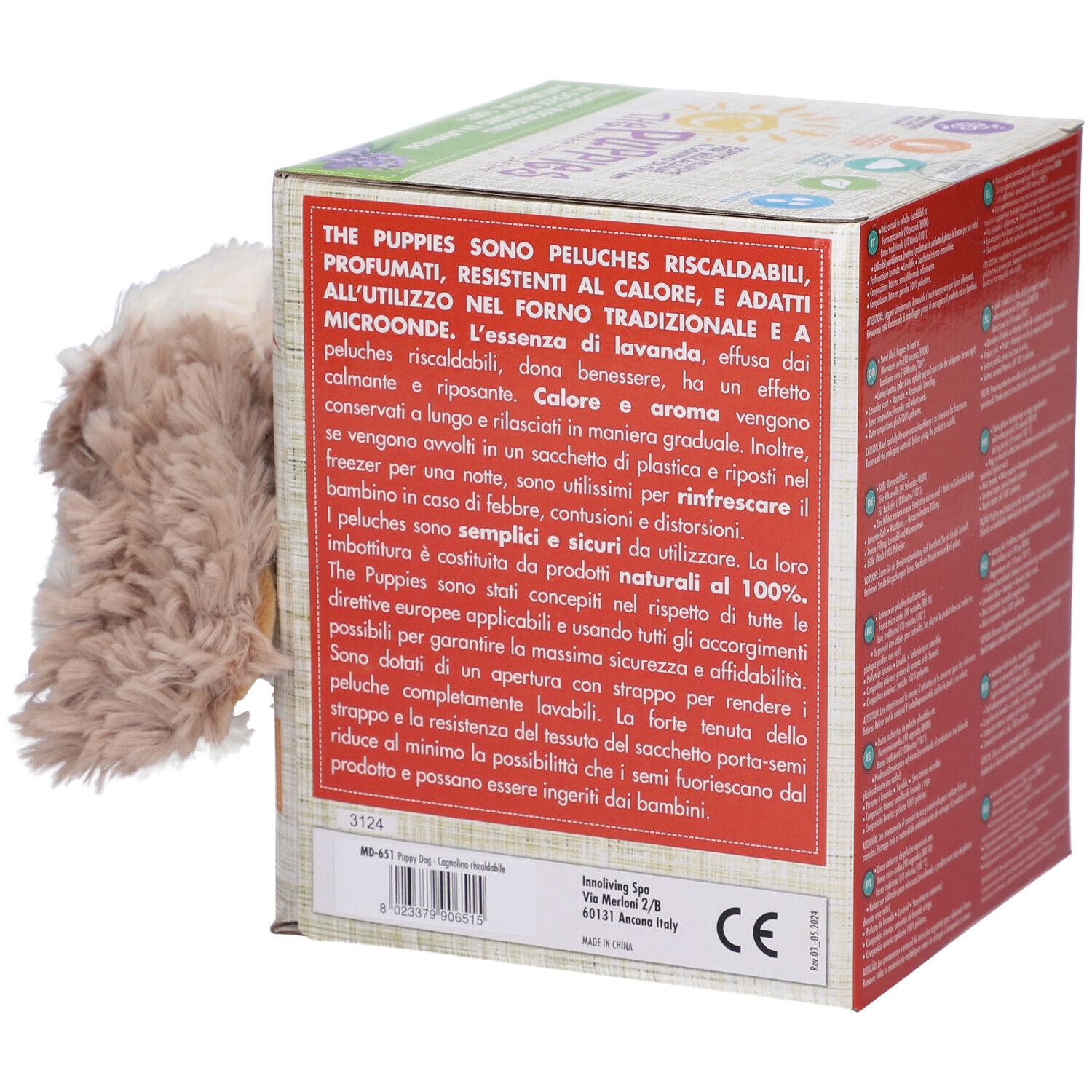 Scatola di cartone con informazioni sul prodotto in italiano. Il cagnolino di peluche è parzialmente visibile.