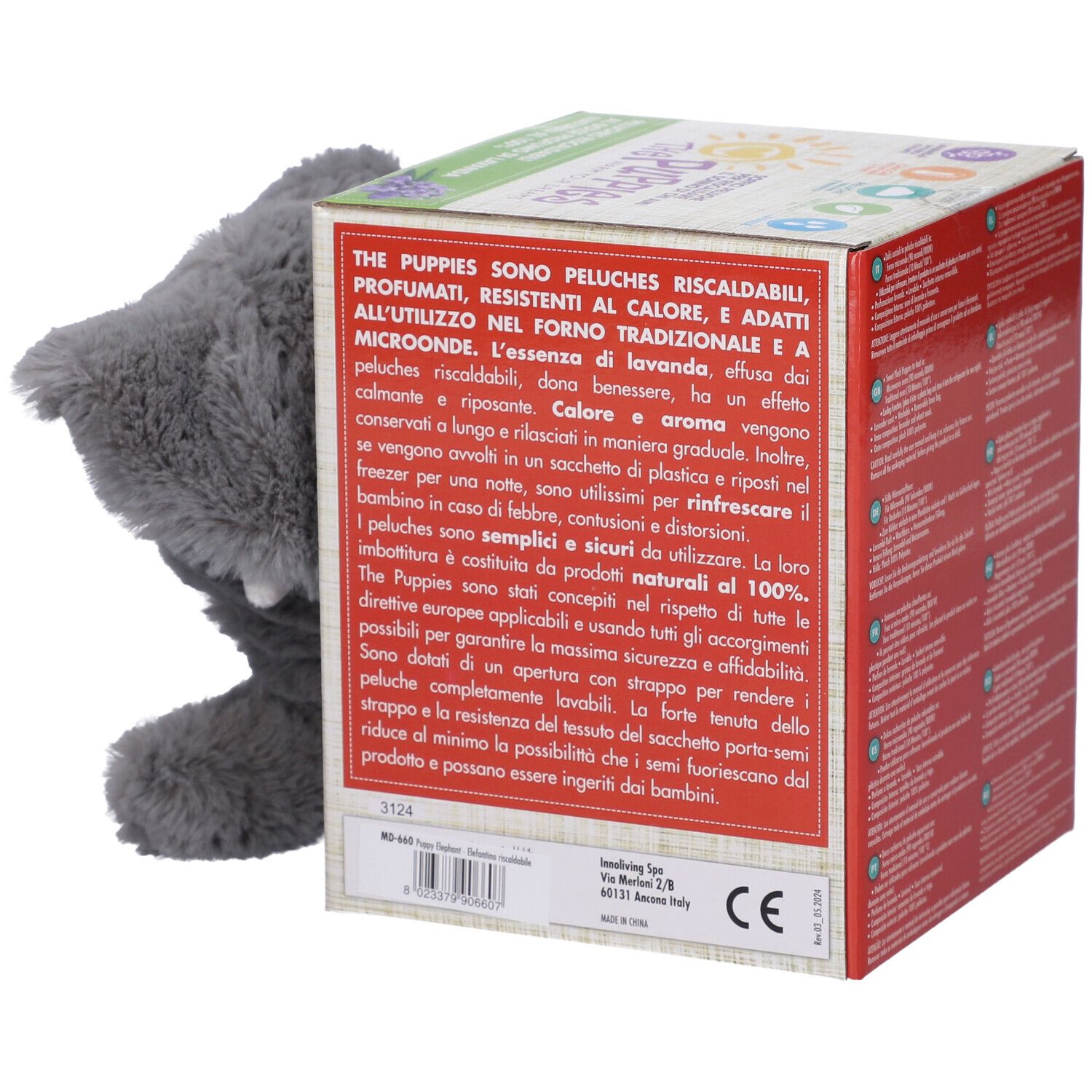 Confezione del prodotto con testo in italiano. Peluche elefante grigio che esce dalla confezione.