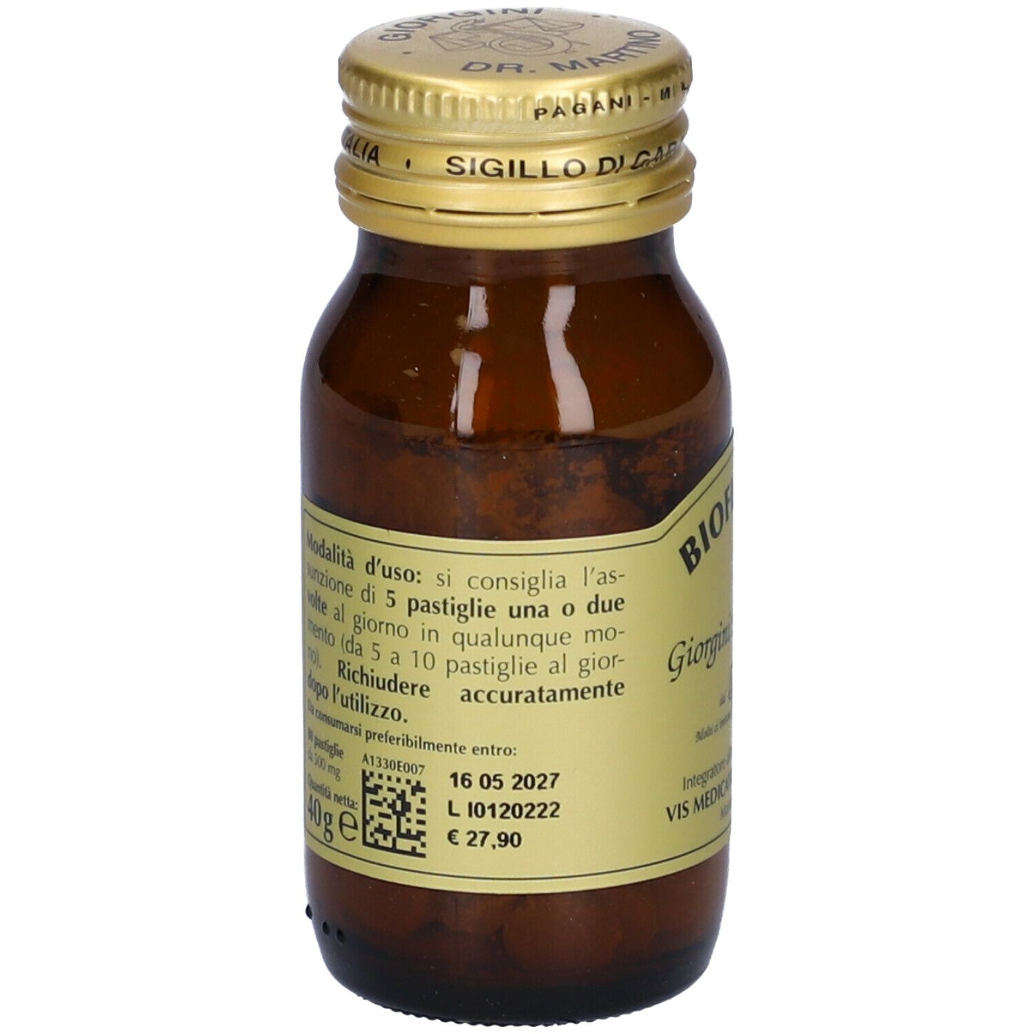 Flacone di vetro marrone con tappo dorato. Etichetta con nome del prodotto e testo. Contiene compresse.