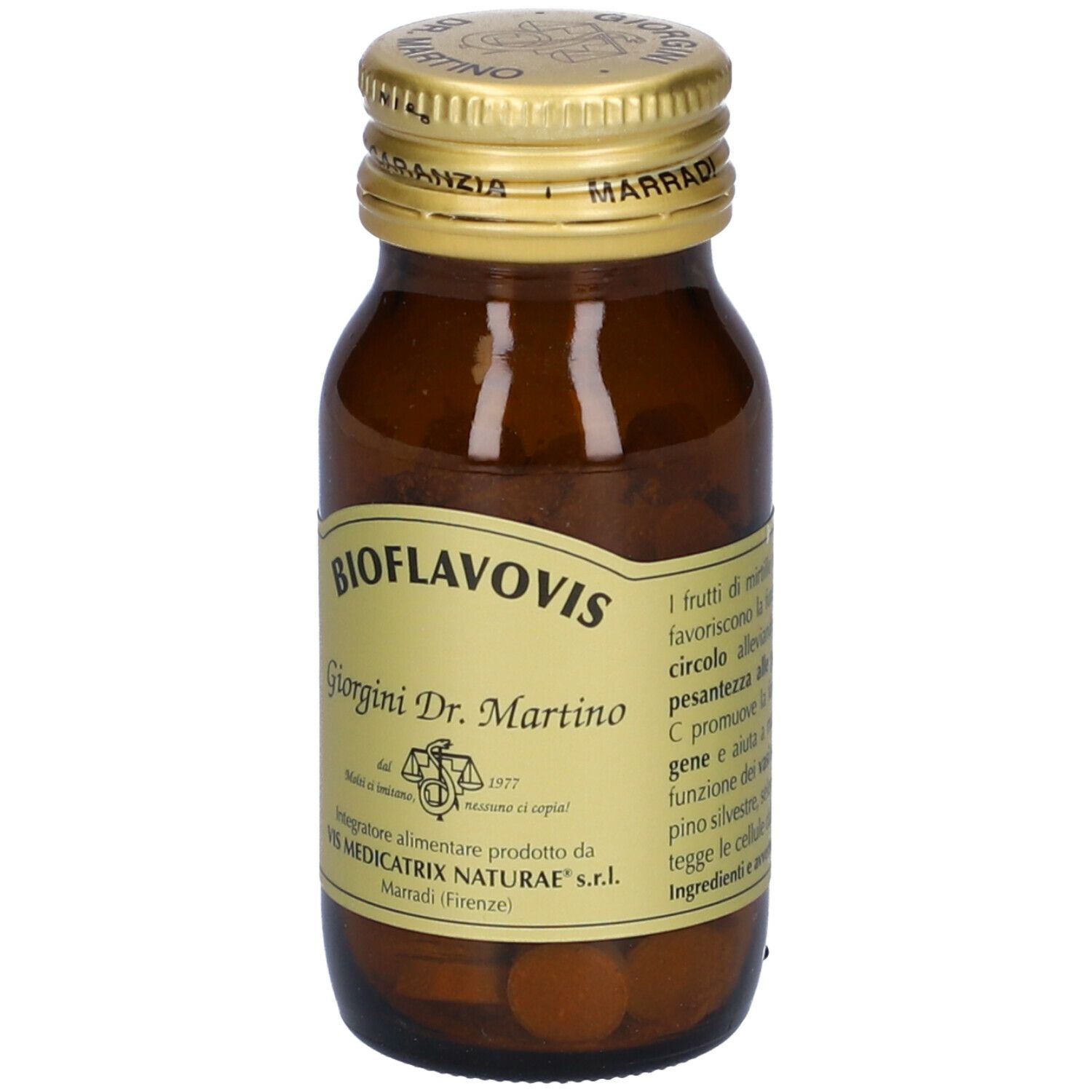 Flacone di vetro marrone con tappo dorato. Etichetta con nome del prodotto e testo. Contiene compresse.