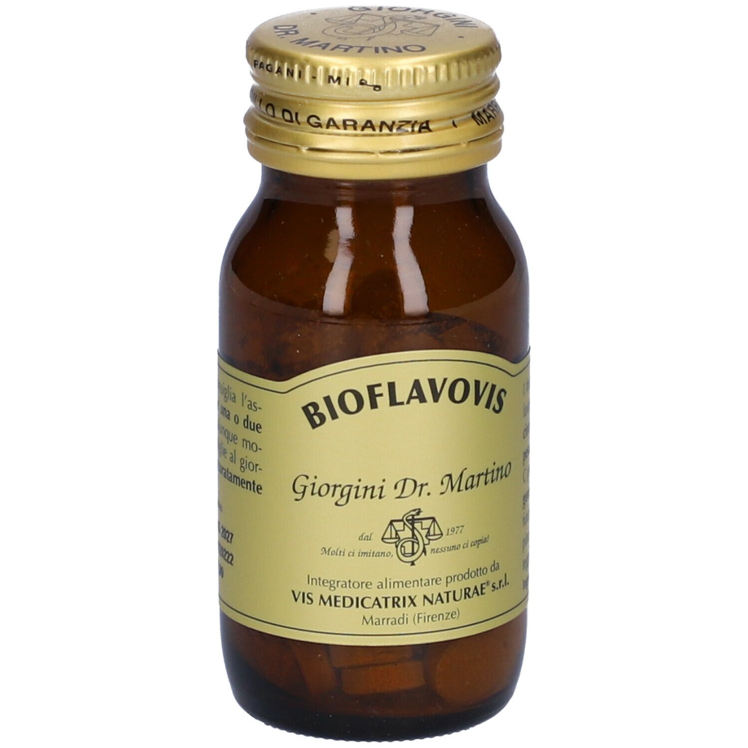 Flacone di vetro marrone con tappo dorato. Etichetta con nome del prodotto e testo. Contiene compresse.