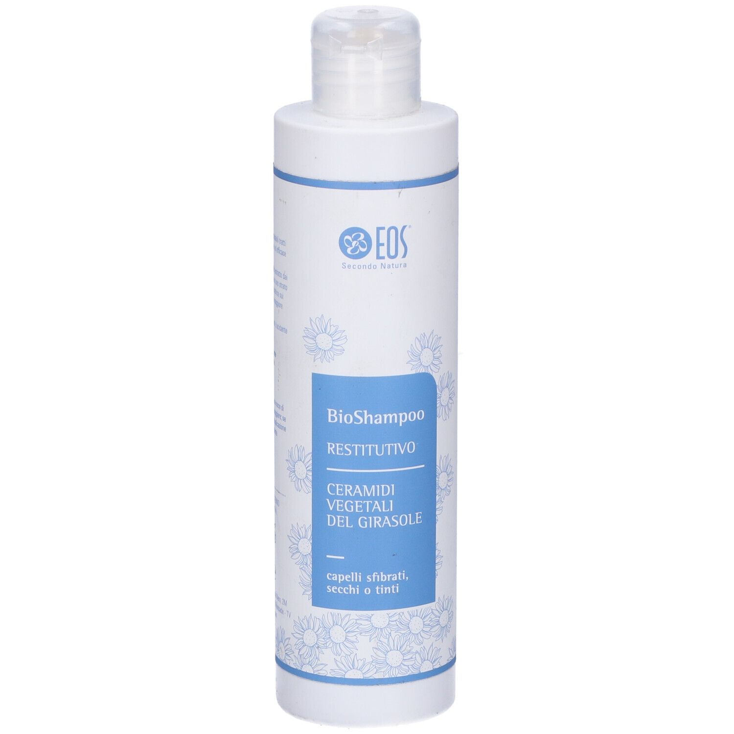 Flacone bianco con etichetta blu. Scritta: Eos, BioShampoo Restitutivo, Ceramide vegetali del girasole. Per capelli sfibrati.
