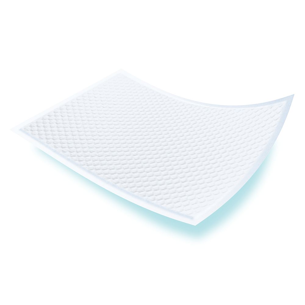 Pad per incontinenza rettangolare bianco con superficie goffrata. Leggermente curvo.