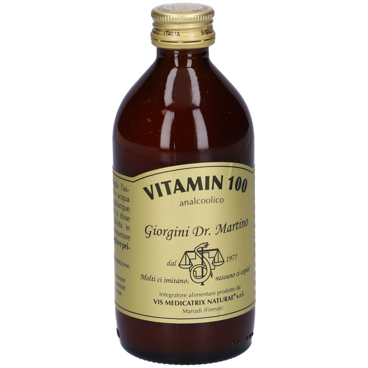 Bottiglia di vetro marrone con tappo dorato ed etichetta. L'etichetta riporta "Vitamin 100 analcolico".
