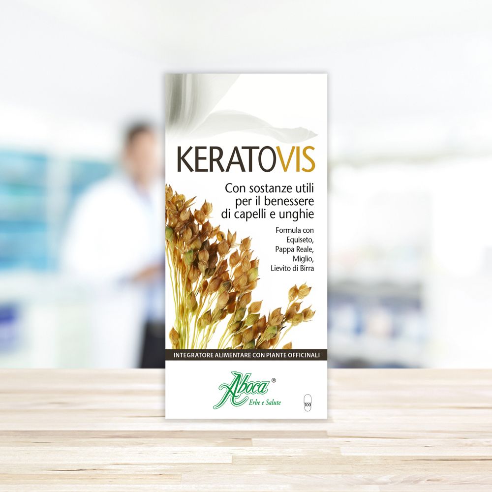 Confezione del prodotto KERATOVIS su un tavolo. Lo sfondo è sfocato. Testo in italiano.