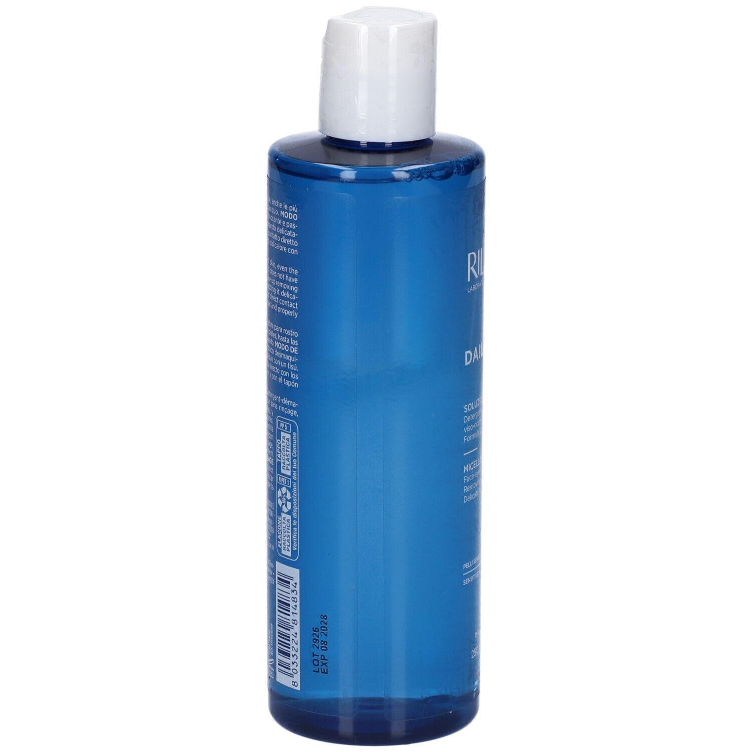 Flacone blu con tappo bianco. Testo sul retro. Informazioni sul prodotto in più lingue.