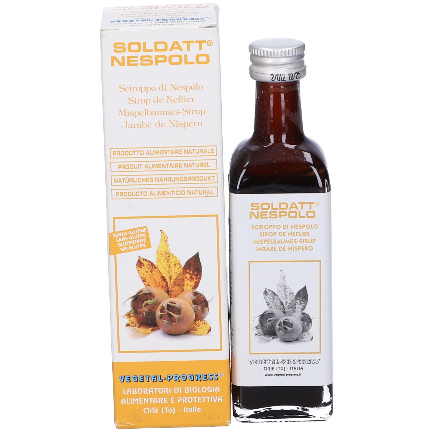 Bottiglia del prodotto accanto alla scatola. Scatola con nome del prodotto, illustrazione di frutta e testo.