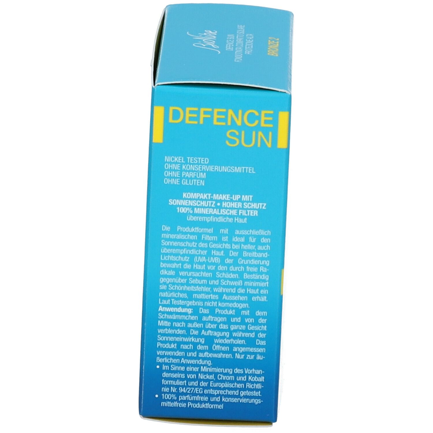 Scatola azzurra. Scritta DEFENCE SUN, marchio BioNike. Testo multilingue. Lato della confezione.