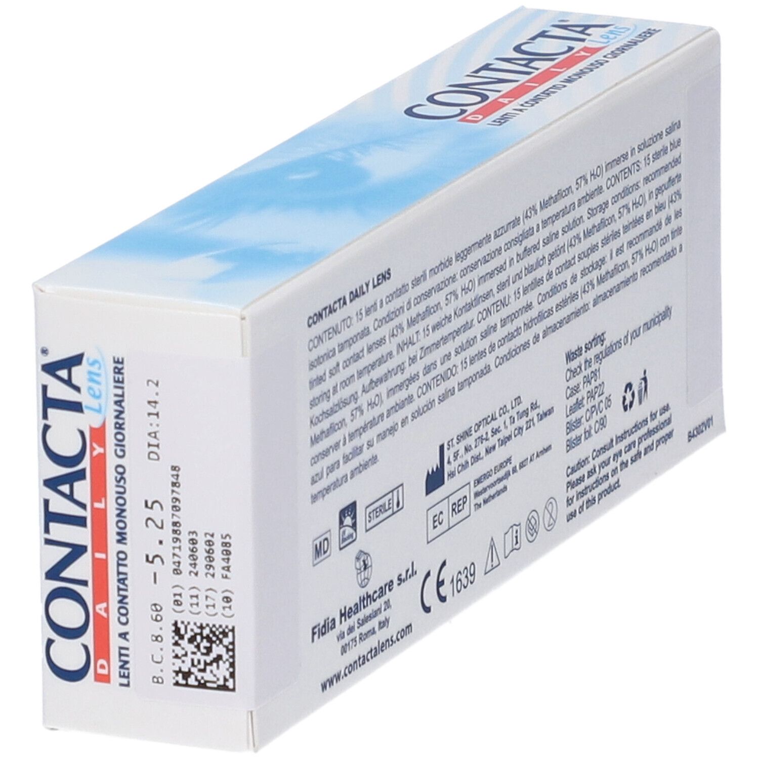 Vista obliqua della confezione di lenti a contatto. Testo multilingue, incluse informazioni sugli ingredienti e il produttore.