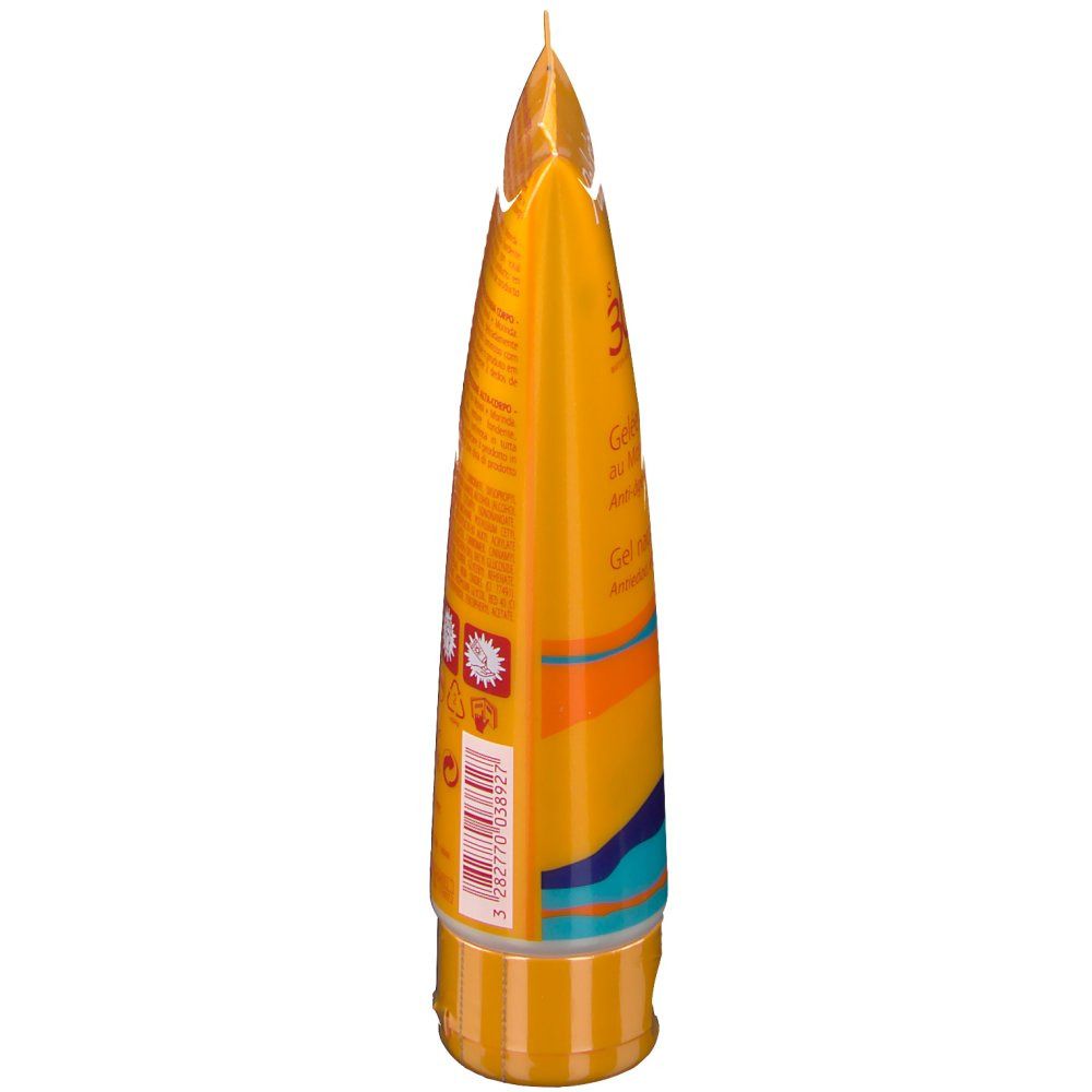 Tubo di gel giallo, vista laterale. Scritte ed elementi di design. In basso: tappo a vite. In alto: punta.