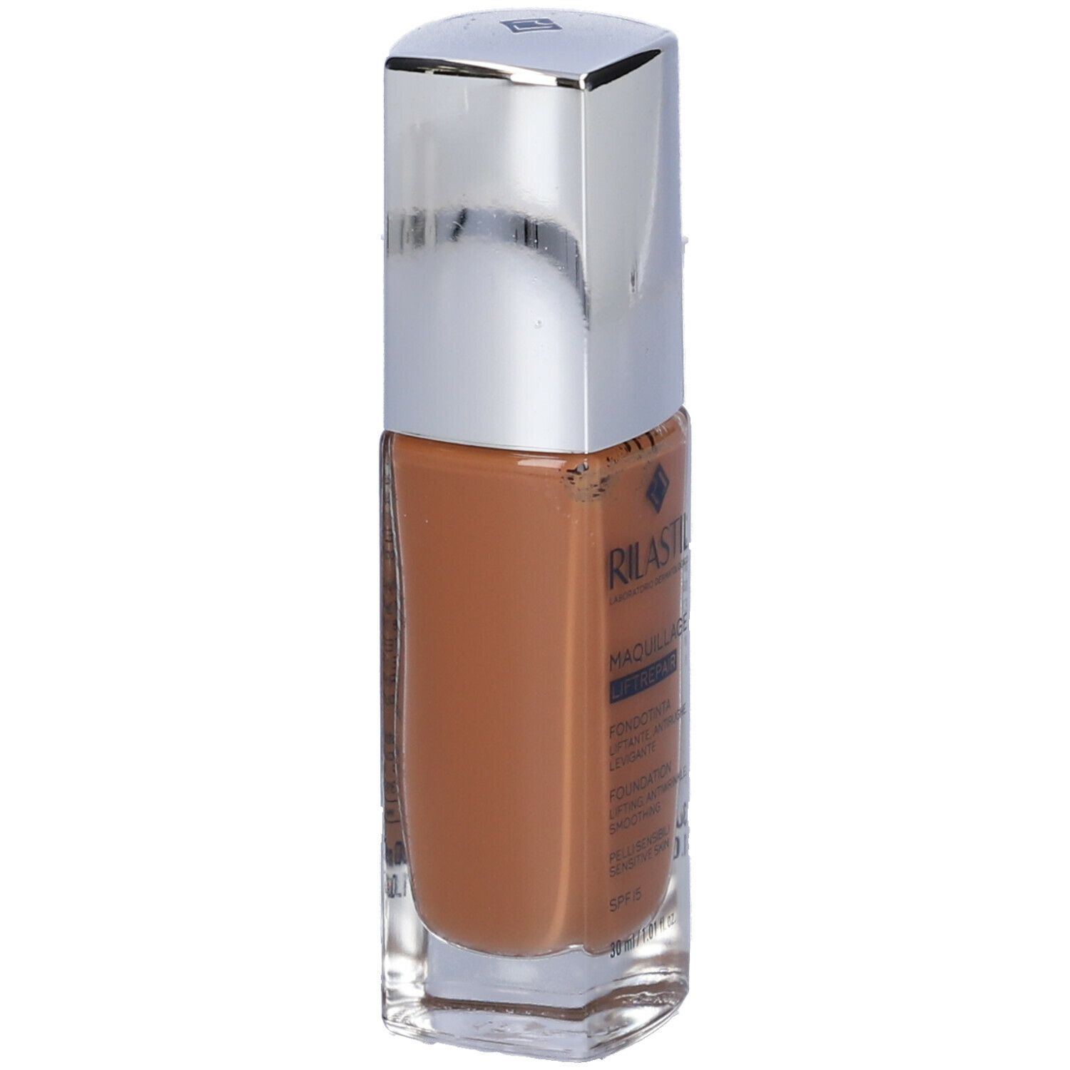 Lato di un fondotinta marrone in flacone di vetro con tappo argentato. Testo in italiano.