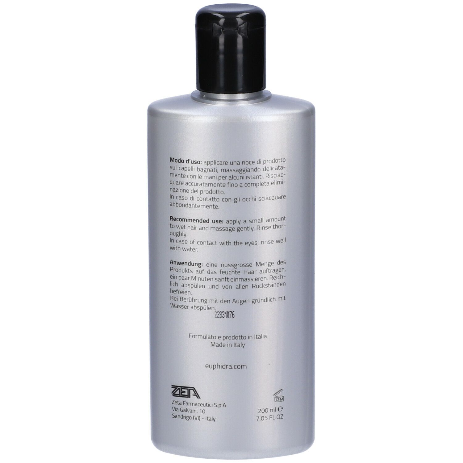 Retro di un flacone di shampoo argento con tappo nero. Testo in più lingue.