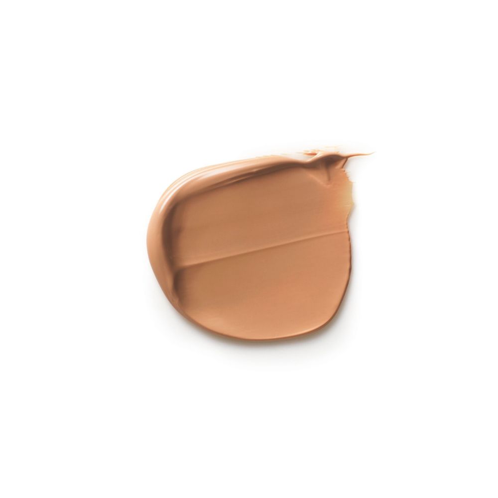 Macchia di crema colorata su sfondo bianco. Il colore è marrone chiaro.