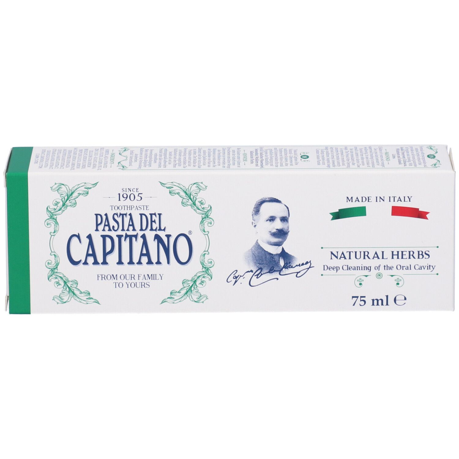 Scatola di dentifricio bianca e verde. Scritta: Pasta del Capitano, Natural Herbs. Bandiera italiana.