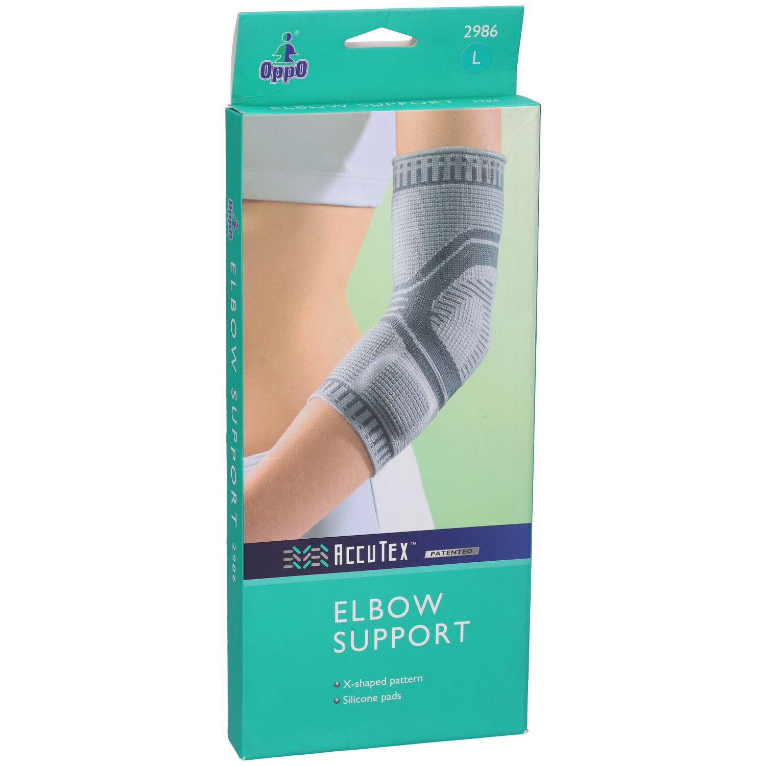 Supporto per gomito Oppo 2986 L. AccuTex Elbow Support. Motivo a X e cuscinetti in silicone. Indossato.