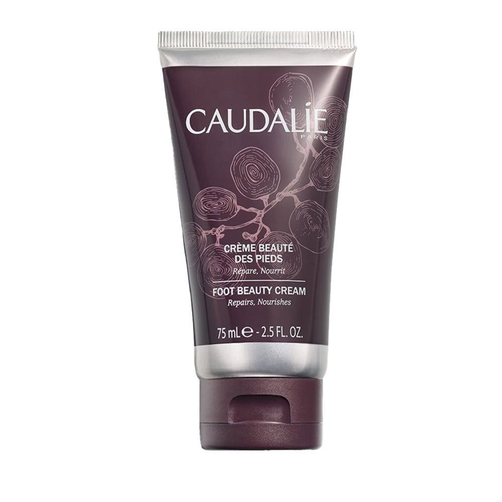 Tubo di crema CAUDALIE. Testo: CRÈME BEAUTÉ DES PIEDS, FOOT BEAUTY CREAM. Design floreale. 75 ml.