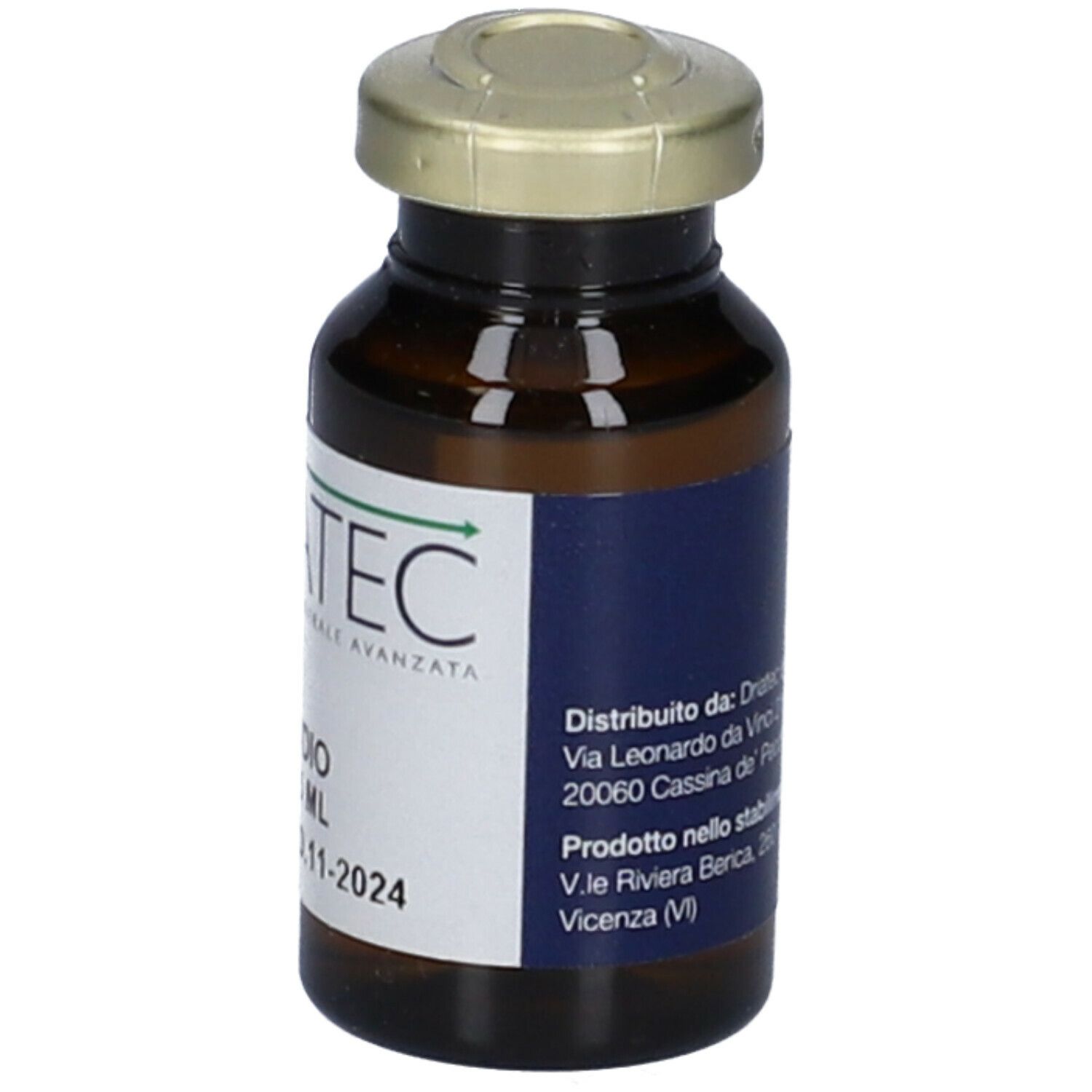Flacone marrone con tappo dorato. Etichetta con informazioni del produttore.