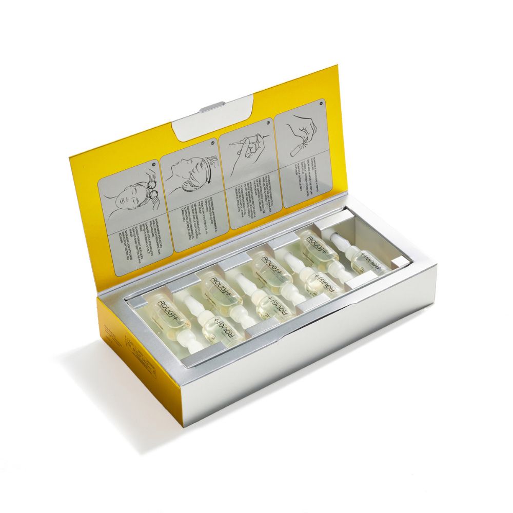 Scatola aperta con 8 fiale Rougj+ Fiale Anti-Sebo. Interno giallo, fiale trasparenti.