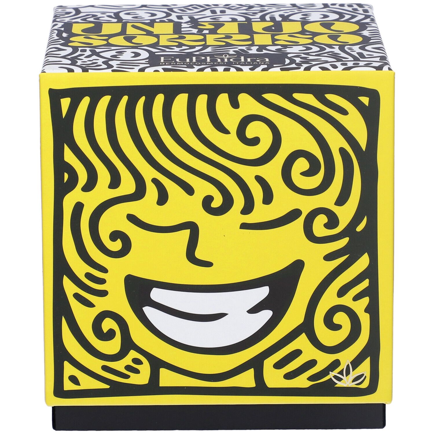 Scatola regalo quadrata con volto giallo e motivi neri. Scritta 'Un Tuo Sorriso'.