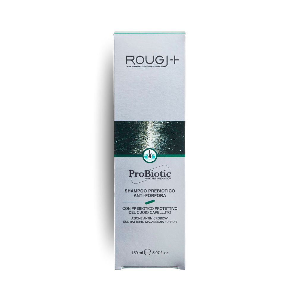 Scatola di shampoo. Scritta: ROUGJ+, ProBiotic, Shampoo Anti-forfora. Design verde-argento.