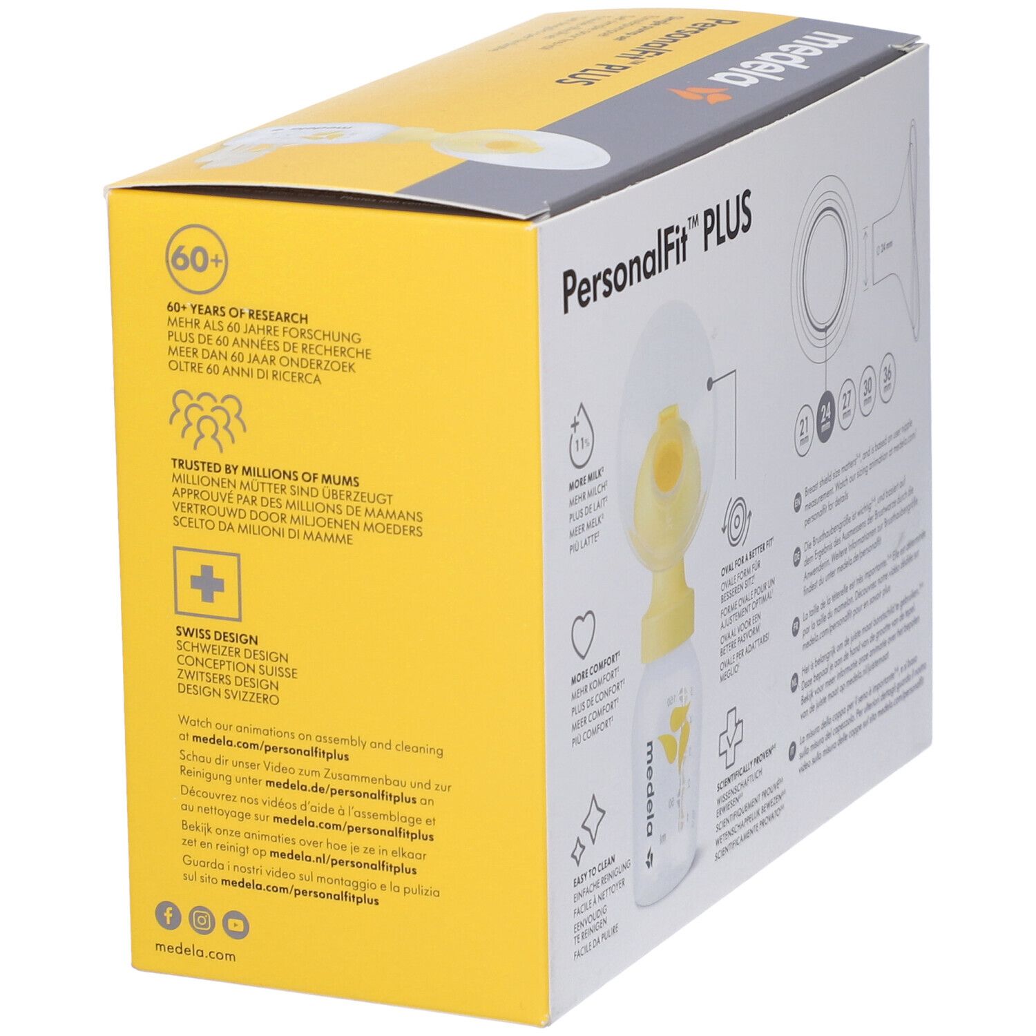 Scatola gialla con immagine del prodotto. Marchio Medela, nome PersonalFit PLUS. Contiene informazioni su ricerca e design.