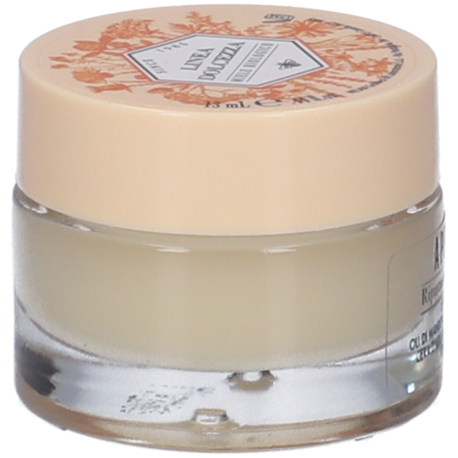 Piccolo vasetto di crema con coperchio. Scritta e illustrazioni sul coperchio. Scritta sul vasetto: APELAB Riparatore Lenitivo.