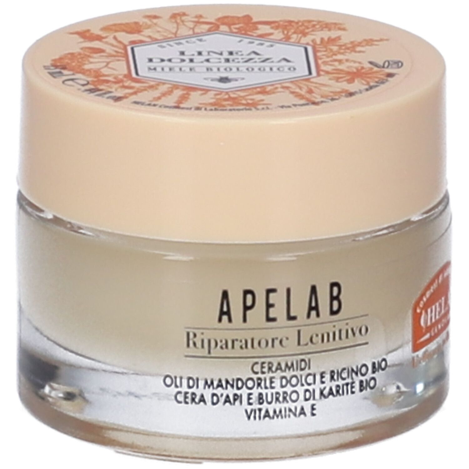 Vasetto di crema con coperchio. Scritta e illustrazioni sul coperchio. Scritta sul vasetto: APELAB Riparatore Lenitivo.