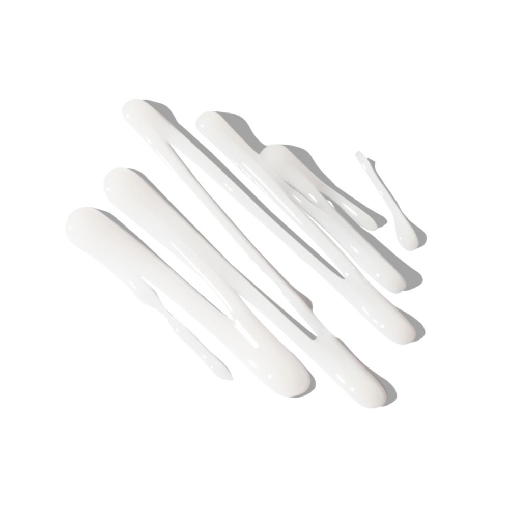 Diverse strisce di gel bianco su sfondo bianco. Consistenza del prodotto.