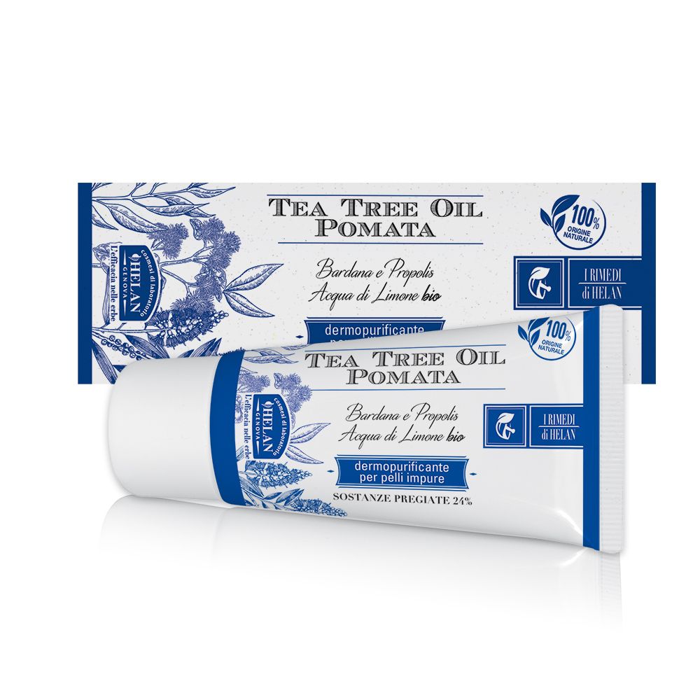 Tubo e confezione Helan Tea Tree Oil Pomata. Bianco con dettagli blu. Testo: Tea Tree Oil Pomata, dermopurificante per pelli impure.