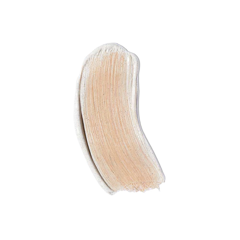 Striscio di prodotto, marrone chiaro con texture cremosa.