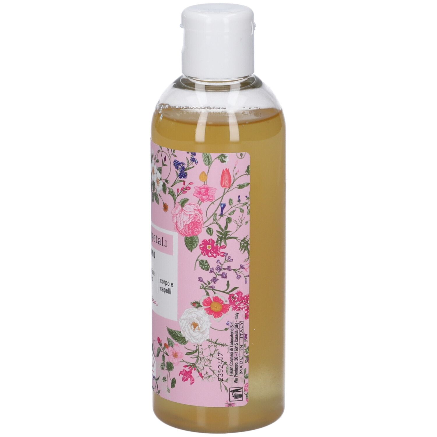 Flacone con liquido giallastro ed etichetta floreale.