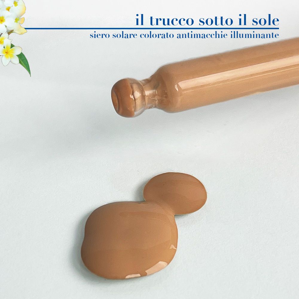 Prodotto su piastra di vetro. Scritta: Siero Solare Colorato Illuminante. Marchio: Helan. Colore del prodotto.