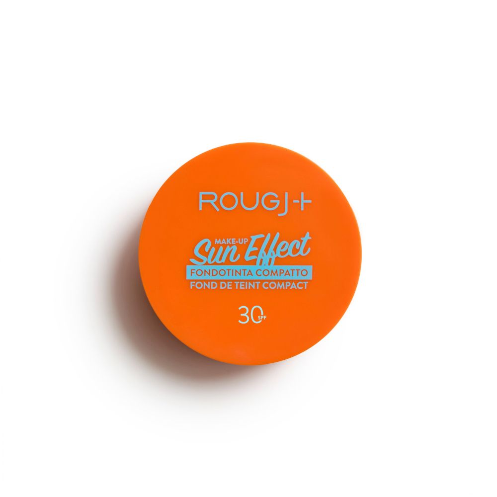 Contenitore rotondo arancione. Scritta: Rougj+, Sun Effect, Fondotinta Compatto, Fond de Teint Compact, SPF 30.