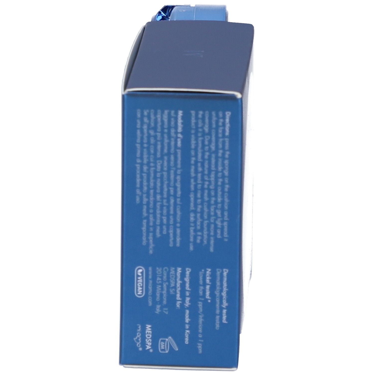 Scatola blu con testo. Sul lato: informazioni sul prodotto, ingredienti, indirizzo del produttore. In alto: logo Miamo.