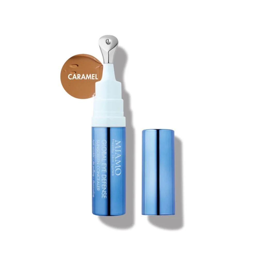 Tubo blu e bianco con applicatore e tappo separato. Scritta MIAMO. Tonalità CARAMEL. Nome prodotto: GLOBAL EYE DEFENSE.