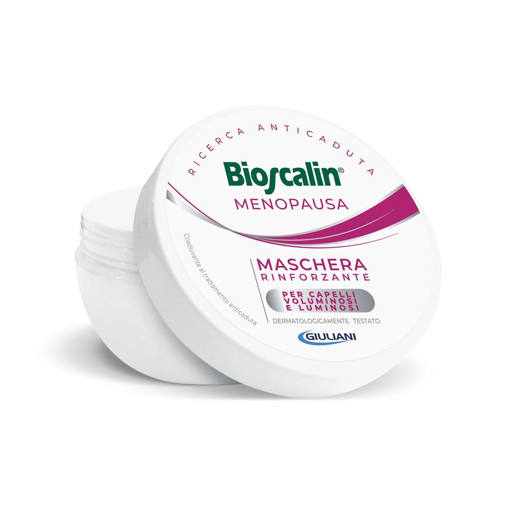 Vaso bianco con coperchio. Sul coperchio, "Bioscalin Menopausa". Sull'etichetta, "Maschera Rinforzante".