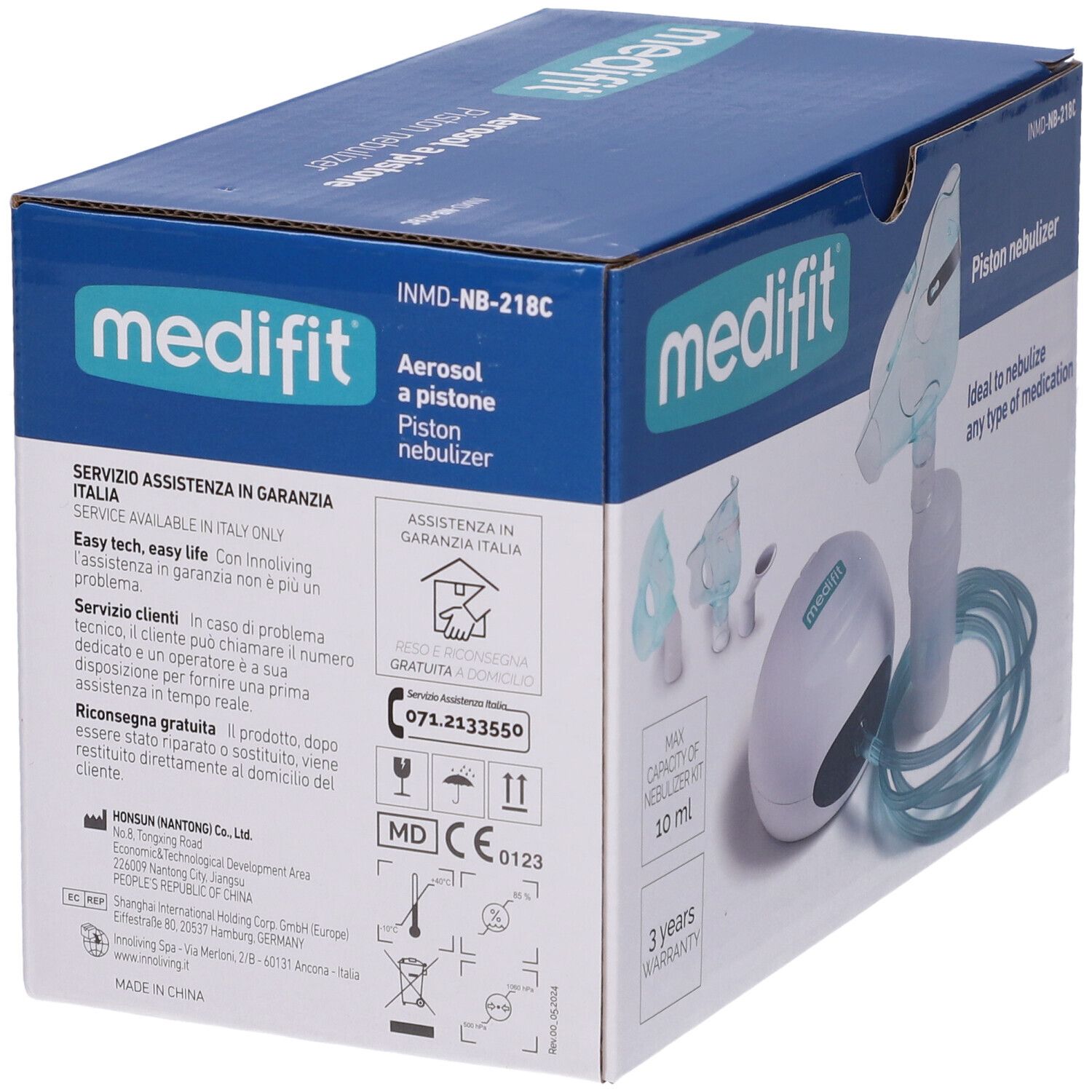 Medifit Aerosol A Pistone. Confezione con inalatore, maschera e tubo. La scatola mostra informazioni di contatto e certificazione.