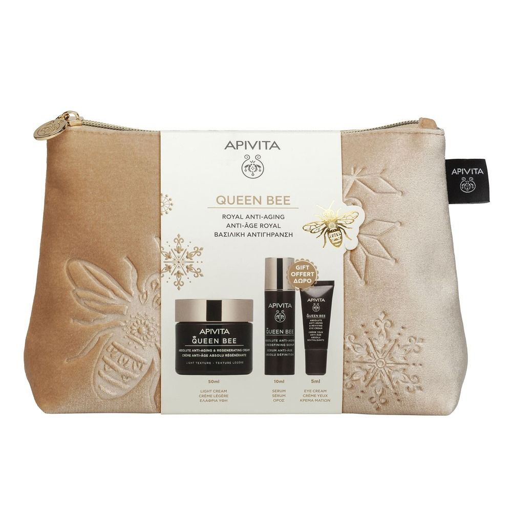 Set regalo cosmetico con pochette dorata e prodotti. Scritta: Apivita Queen Bee. Marchio e logo ben visibili.
