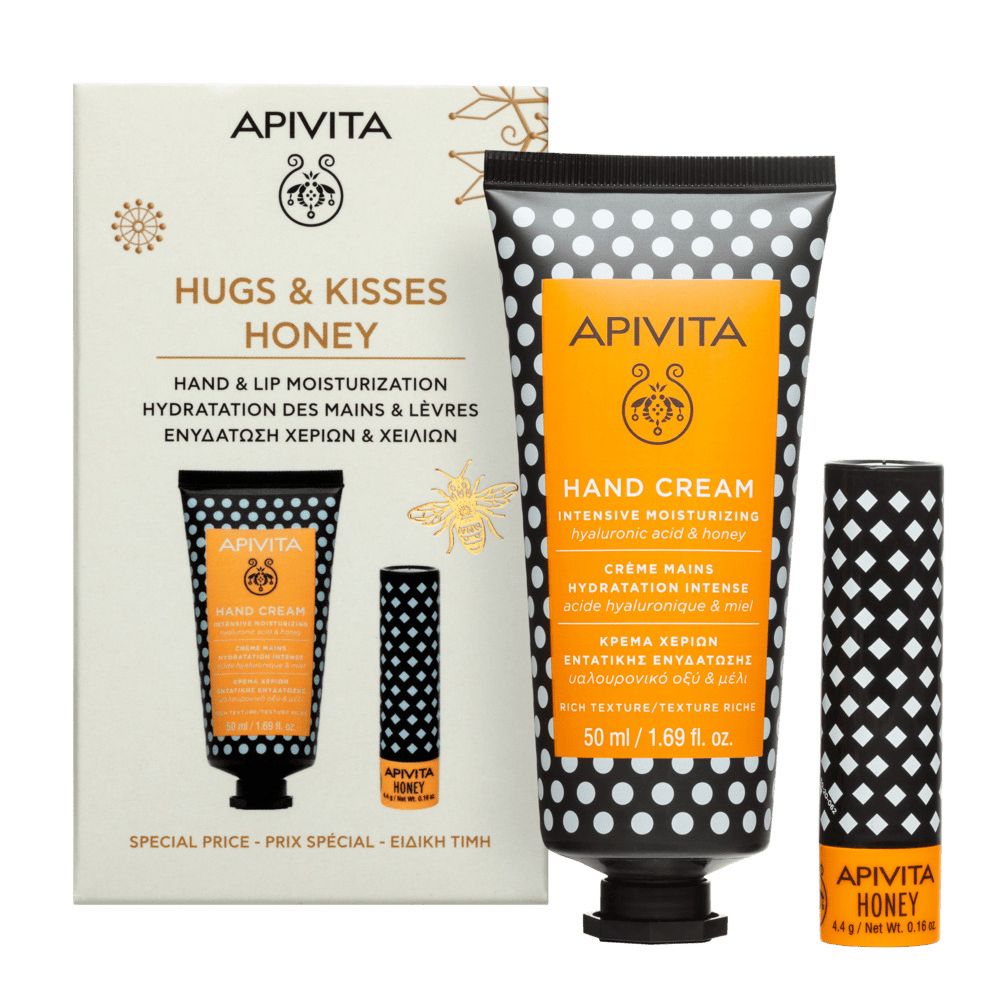 Set regalo con crema mani e balsamo labbra. Tubo crema mani: nero a pois bianchi, etichetta gialla. Balsamo labbra: bianco e nero.