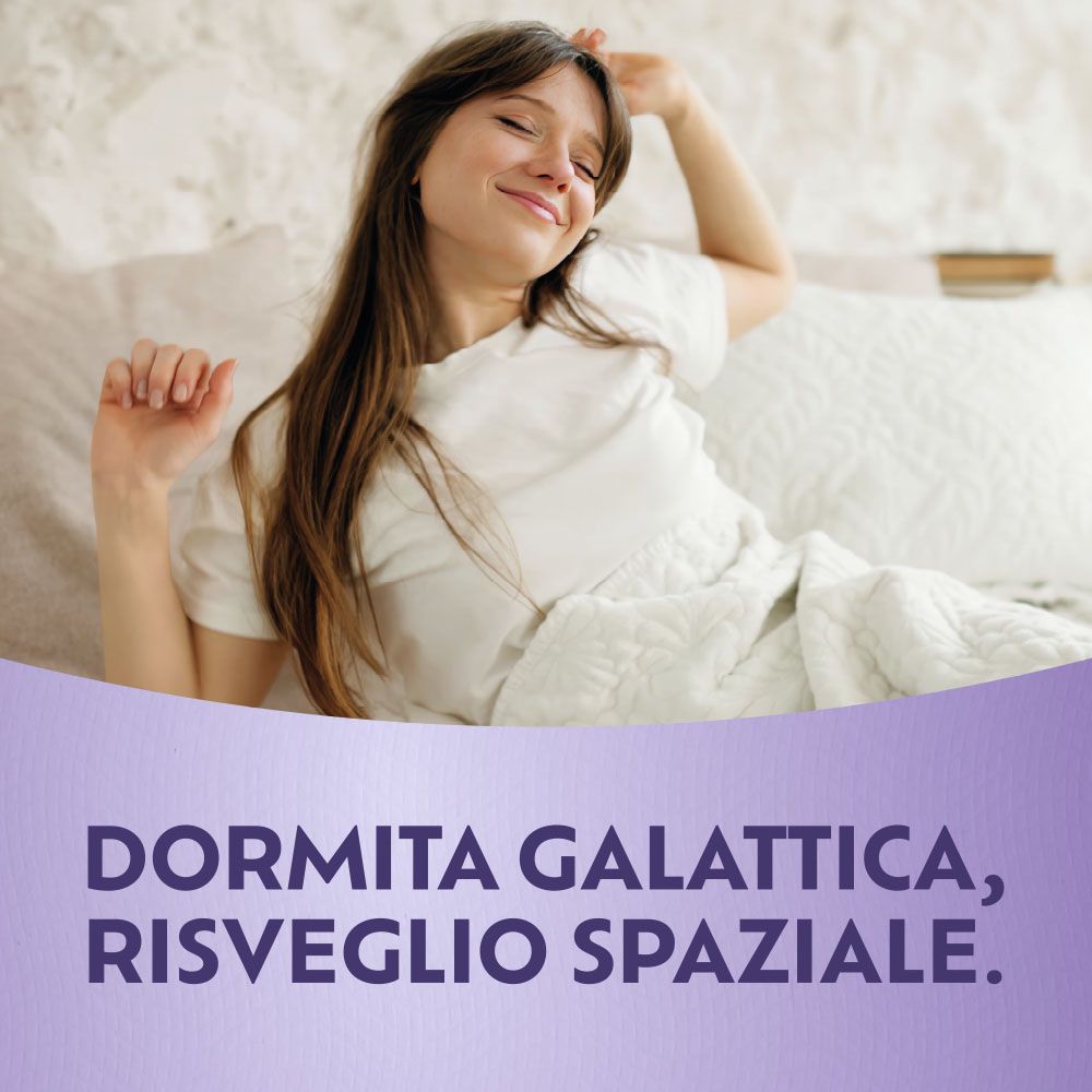 Donna a letto. Testo: Dormita galattica, risveglio spaziale.