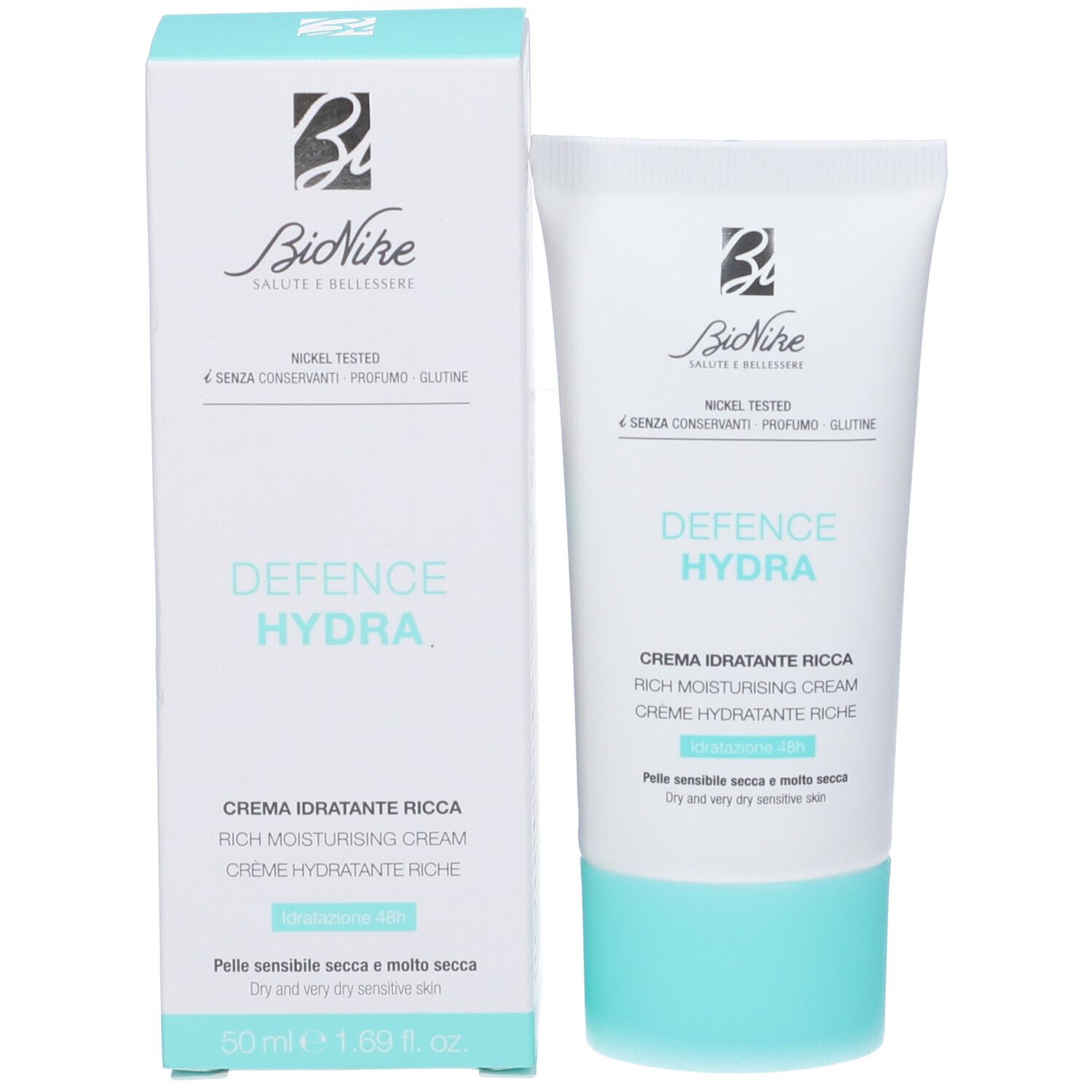 Confezione e tubo del prodotto. Confezione bianca con accenti turchesi. Scritta: Defence Hydra, Crema Idratante Ricca. Marchio: Bionike.