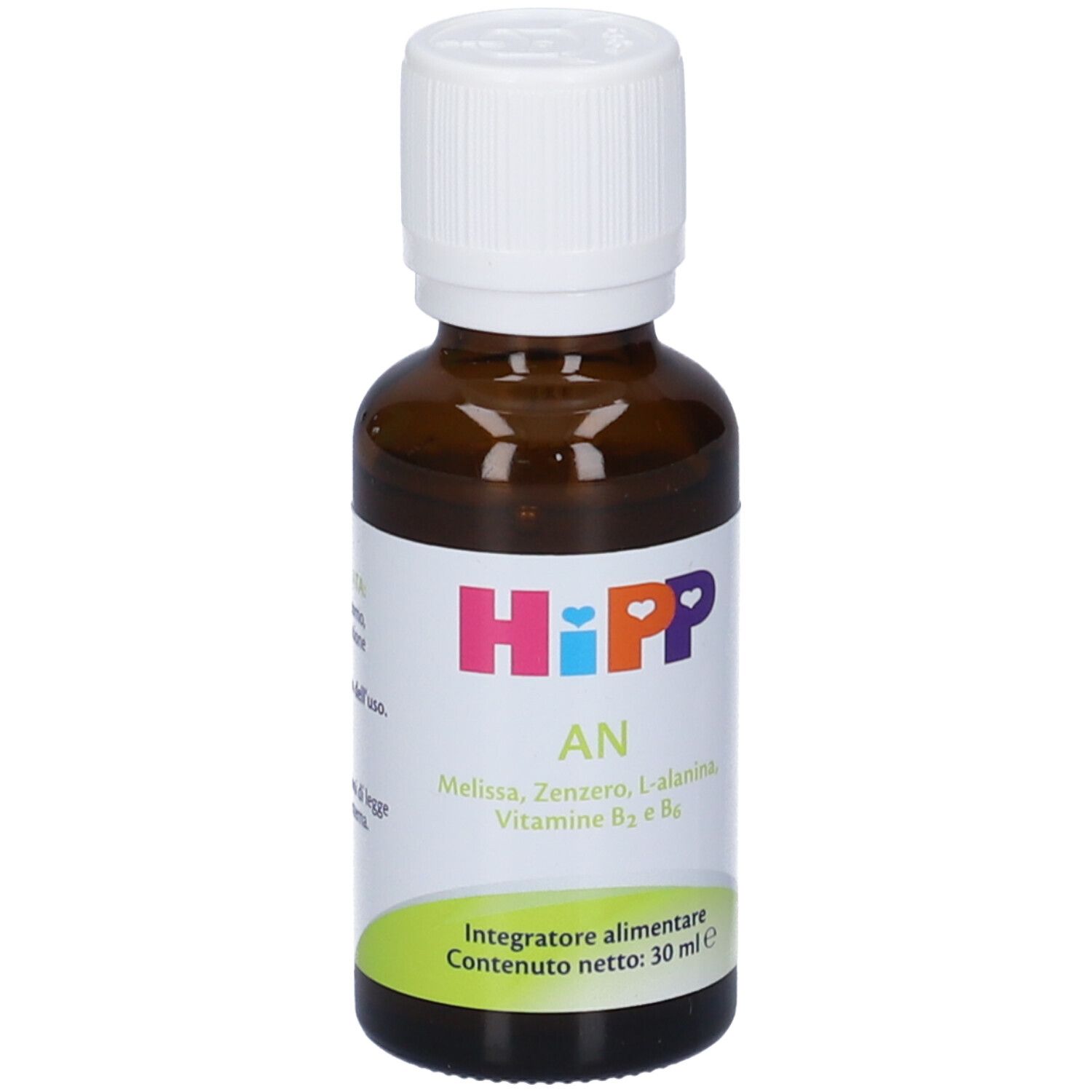 Flacone di vetro marrone con tappo bianco. Etichetta con nome del prodotto, ingredienti e volume. Etichetta verde e bianca in basso.