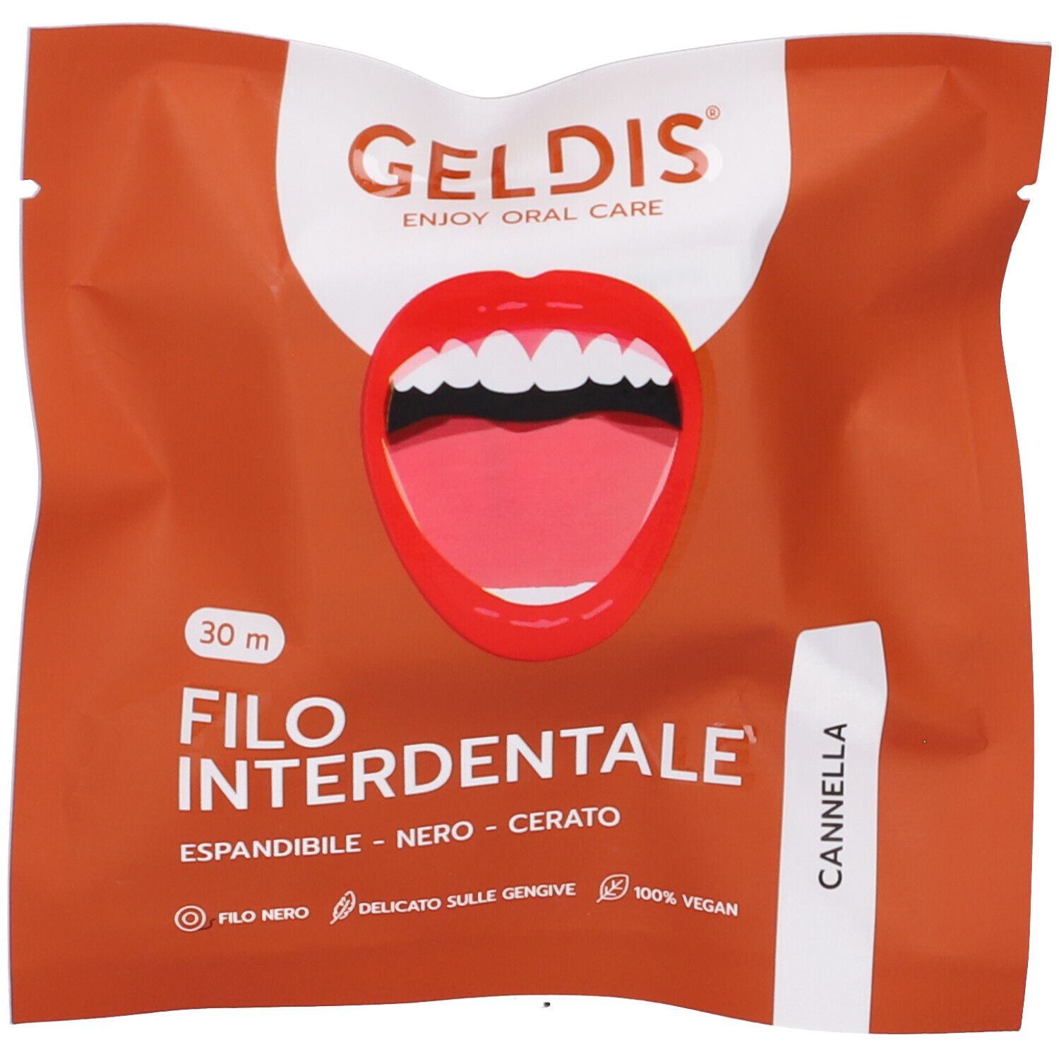 Confezione con nome del prodotto e immagine di una bocca. Testo: Filo Interdentale, Cannella.