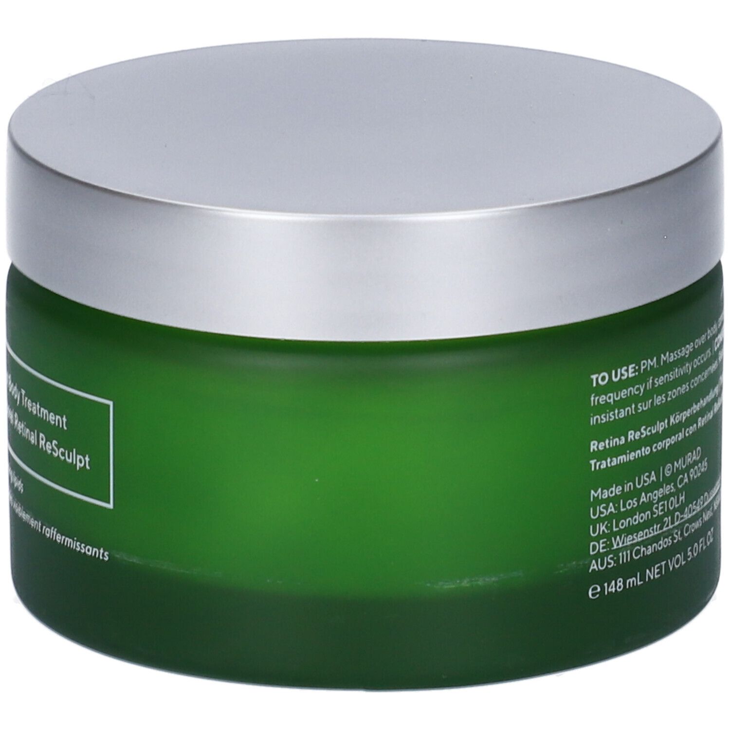 Vaso verde con coperchio argentato. Retro con testo e loghi.