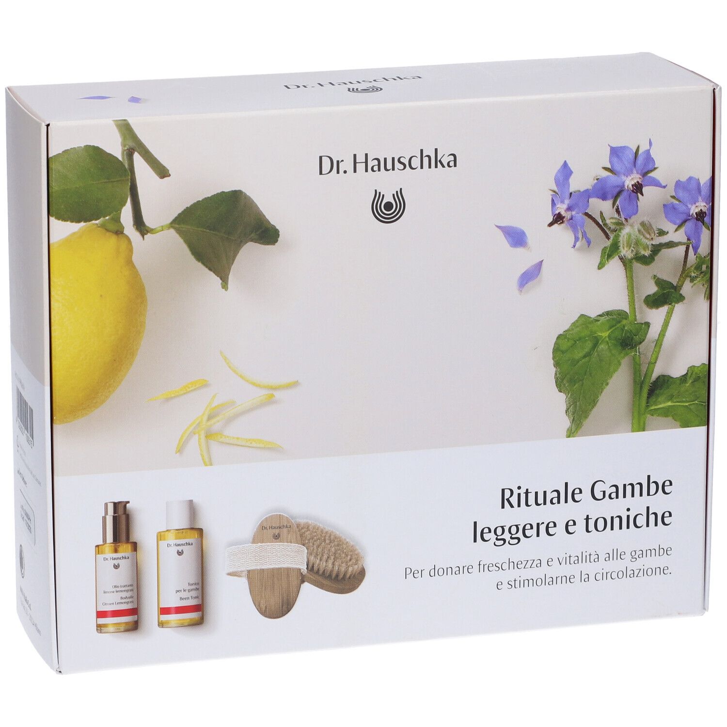 Confezione in cartone con immagini del prodotto e testo. Mostra due flaconi, una spazzola, un limone e fiori. Testo: Rituale Gambe leggere e toniche.