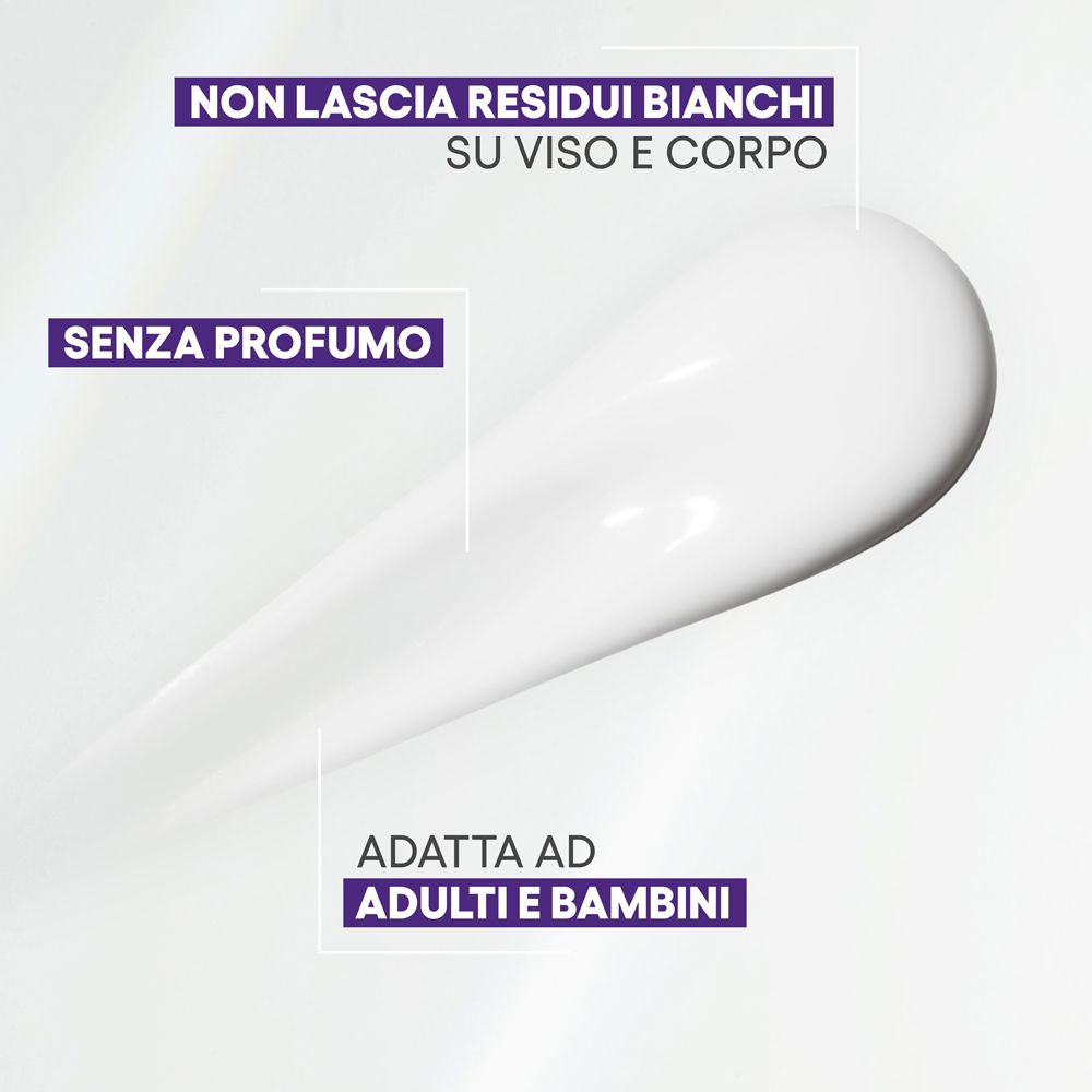 Filo di crema bianca. Testo: Non lascia residui bianchi su viso e corpo. Senza profumo. Adatto ad adulti e bambini.