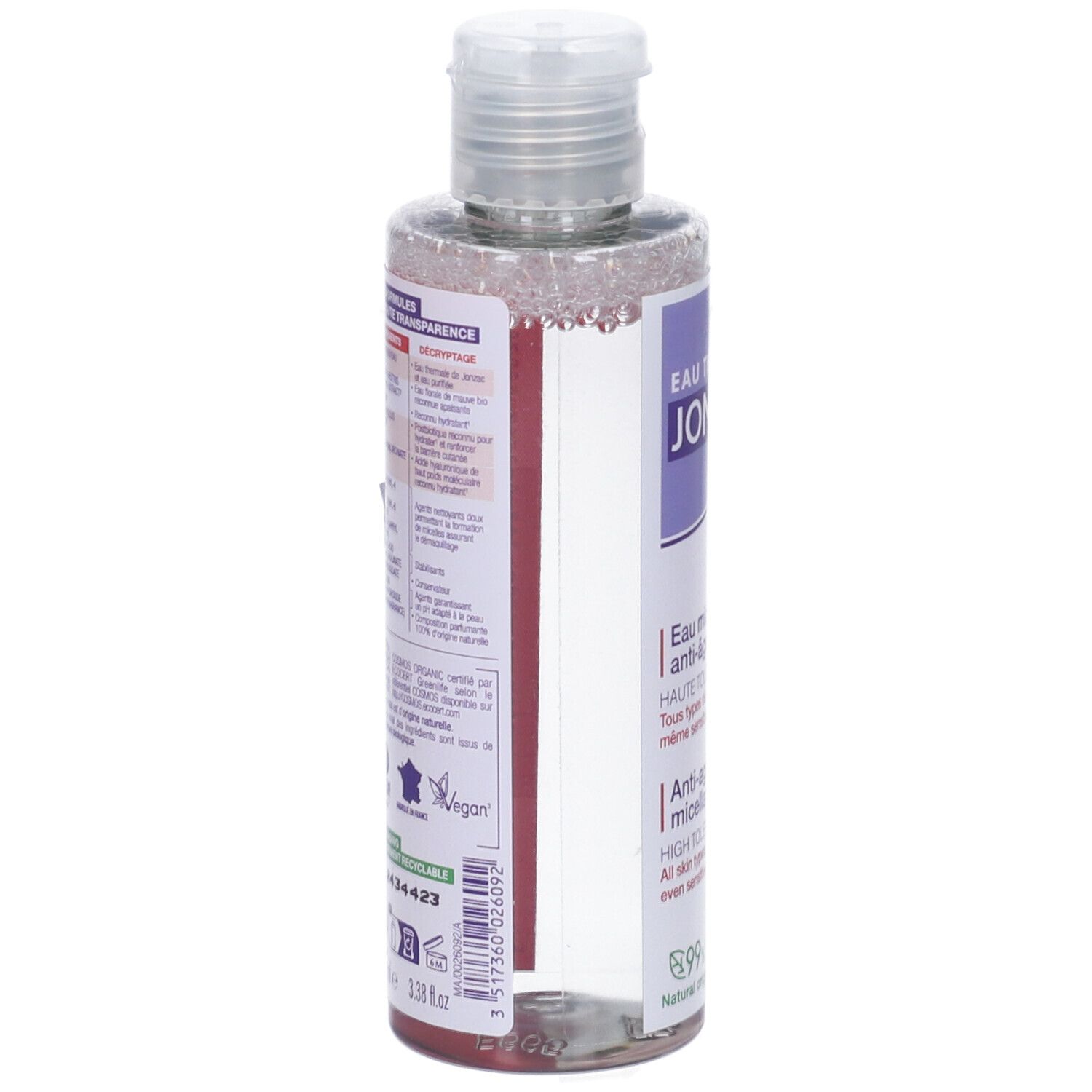 Flacone con etichetta viola. Testo: JONZAC, Eau Thermale, Anti-âge. Logo vegano. Retro con testo e codice a barre. Tappo trasparente.